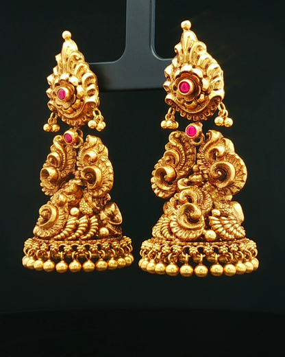 Antique Yellow Gold Nakshi Jhumka Earrings with Round Cabochon Rubies