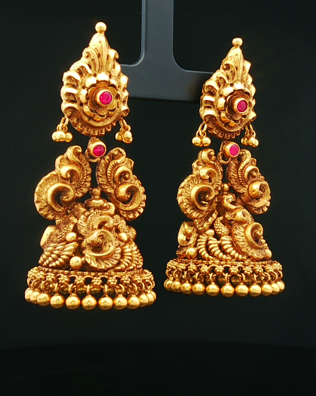 Antique Yellow Gold Nakshi Jhumka Earrings with Round Cabochon Rubies